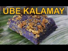 a close up of a piece of food on a leaf with the words ube kalamay above it