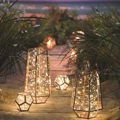 some lights that are sitting in the sand