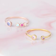 "♥ Custom Birthstone Ring ♥ Customed by kids' birthstones, this beautiful and dainty ring is a perfect gift for your mom or your loved one. P R O D U C T ∙ I N F O * Material: Solid 925 Sterling Silver * Finishing: Silver - Yellow Gold - Rose Gold * Up to 1 big stone, 5 small stones * Big stone measures approx. 1/8'' (3mm) , Small stones measure approx. 1/16'' (2mm) H O W * T O * O R D E R 1. Select the drop-down option you want 2. Please let us know the following information in the \"Add your p Pink Birthstone Ring For Birthday, Adjustable Stackable Rings For Birthday, Adjustable Stackable Birthstone Ring For Mother's Day, Adjustable Birthstone Ring For Birthday, Adjustable Bezel Setting Birthstone Ring As Gift, Adjustable Bezel Set Birthstone Ring Gift, Personalized Birthstone Ring For Birthday Gift, Adjustable Stackable Birthstone Ring For Birthday, Stackable Birthstone Ring For Mother's Day