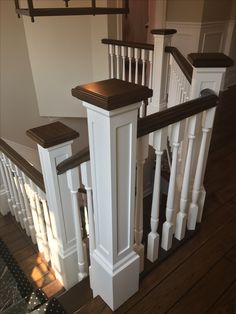 the stairs in this house are made of wood and white