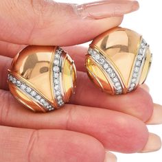 These clip-back diamond earrings By Dario are artfully rendered in high polished solid 18K Tricolor gold. These Circular-Shape earrings set with high-quality round diamonds set in18k white gold weighing approx. 1.45 carats G-H color, VS clarity Featuring non- posts clip-backs, these stylish Bvlgari earrings are designed for pierced and non pierced ears. in pristine condition Signed By Dario Weight: 25.5 grams Measurements: 23 mm diameter Accompanied by professional appraisal document. Yellow Gold Round Diamond Earrings With Polished Finish, Luxury Gold Diamond Clip-on Earrings, Gold Polished Round Diamond Earrings, Luxury Polished Diamond Earrings For Anniversary, Polished Diamond Round Cut Earrings, Luxury Diamond Earrings For Anniversary With Polished Finish, Gold Round Diamond Earrings With Polished Finish, Formal Diamond Earrings With Polished Finish, Gold Diamond Earrings With Polished Finish