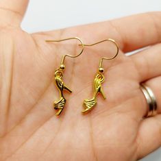 Gold plated high heel shoe charms on gold plated stainless steel earring hooks. Yellow Gold Earrings With Dangling Charms As Gift, Gold Plated Charm Earrings As Gift, Gold Dangle Earrings With Vintage Charm, Yellow Gold Charm Drop Earrings, Gold Vintage Charm Drop Earrings, Shoe Earrings, Charms Earrings, Jewelry Charms, Gold Heels