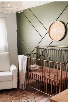 a baby's room with a crib and chair