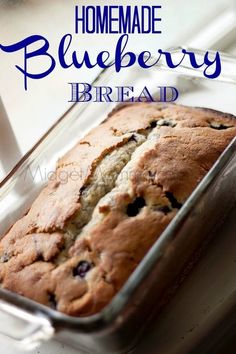 a loaf of blueberry bread in a glass container with the words homemade blueberry bread