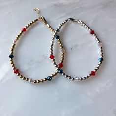 We're celebrating America in the way we do best - with jewelry handmade in the USA (Hoboken, NJ)! This listing is for one of our three red, white, and blue bracelet styles. Choose a triple mini heart bracelet, a triple mini star bracelet, or a swarovski bracelet. Also choose between gold-filled, rose gold-filled, and sterling silver finishes. One inch of extra chain lets you adjust the bracelet to your preference. All items are hand-made in the USA in a smoke-free studio, and most importantly, t Adjustable Jewelry With Faceted Beads For Celebration, Adjustable Faceted Beads Jewelry For Celebration, White And Blue Bracelet, Bracelet Styles, Swarovski Bracelet, Star Bracelet, Mini Heart, Swarovski Jewelry, Blue Bracelet