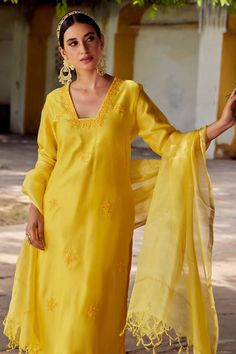 Mustard yellow kurta with floral embroidery and side slits. Paired with palazzo and dupatta.
Components: 3
Pattern: Embroidered
Type Of Work: Floral
Neckline: Square
Sleeve Type: Three quarter
Fabric: Chanderi silk
Color: Yellow
Other Details: 
Tassel border dupatta
Length:
Kurta: 46 inches
Palazzo: 36 inches
Occasion: Puja - Aza Fashions Elegant Yellow Salwar Kameez With Resham Embroidery, Elegant Yellow Sets With Resham Embroidery, Fitted Yellow Salwar Kameez With Sheer Dupatta, Elegant Yellow Unstitched Suit With Resham Embroidery, Yellow Chanderi Saree With Floral Embroidery, Elegant Embroidered Yellow Salwar Kameez, Elegant Yellow Embroidered Salwar Kameez, Elegant Yellow Embroidered Sharara, Yellow Chanderi Kurta With Sheer Dupatta