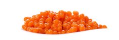 a pile of orange candies sitting on top of a white table