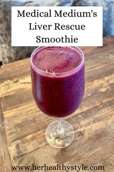 a purple smoothie in a glass with the words medical medium's liver rescue smoothie