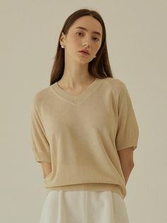 This is a feminine and modern top by MangoManyPlease that is made out of high quality and sturdy material. With distinctive mood of the design and comfortable wear, you can style it for your feminine daily outfit.- Cool touch of linen blend fabric- Ribbed cuffs, necklie, and hem- Trendy and feminine mood Beige Cotton V-neck Knit Top, Cream Fine Knit V-neck Top, Beige V-neck Cashmere Top, Beige Cashmere V-neck Top, Chic Cashmere Tops In Solid Color, Chic Solid Cashmere Tops, Spring Beige Cashmere Tops, Beige Cashmere Tops For Spring, Beige Cashmere Tops For Everyday