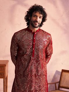 Shrestha by Vastramay - Men's Maroon Georgette Embellished Kurta Patiala Set Look dapper in this festive kurta patiala set. Made from luxurious georgette, the kurta features a mandarin collar, long sleeves with embellishments, and a straight knee-length cut. The solid cream patiala with an elasticated waistband completes the look. Perfect for weddings, parties, and other special occasions. Key Features Maroon georgette kurta with embellishments Mandarin collar Long sleeves Straight knee-length c Georgette Kurta, Looking Dapper, Sleeves Top, Georgette Fabric, Hot Outfits, Packaging Labels, Product Images, Mandarin Collar, Straight Cut