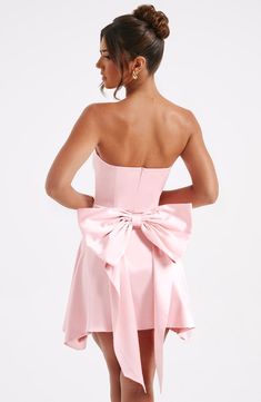 Freja Mini Dress - Blush – BABYBOO Party Strapless Mini Dress With Bow Tie Back, Strapless Mini Dress With Bow For Cocktail, Glamorous Strapless Dress With Bow For Evening, Strapless Mini Dress With Bow Tie Back, Elegant Strapless Dress For Homecoming, Elegant Strapless Mini Dress With Bow, Chic Strapless Dress With Satin Bow For Party, Strapless Cocktail Dress With Bow Tie Back, Elegant Strapless Mini Dress With Satin Bow