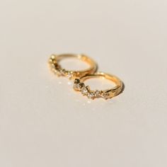 14k Yellow Solid Gold Sold as a pair 11mm Huggies with snap closure 7 diamonds .11CT per hoop. SI-quality All 14k pieces are made to order. Our 14k solid gold will not oxidize or discolor, so you can wear your jewelry every day, everywhere, for years to come. Our diamonds are ethically sourced/conflict-free. Timeless Gold Round Cut Huggie Earrings, Yellow Gold Tarnish Resistant Huggie Earrings For Anniversary, Anniversary Yellow Gold Tarnish Resistant Huggie Earrings, 14k Gold Huggie Earrings With Vvs Clarity For Wedding, 14k Gold Vvs Clarity Huggie Earrings For Wedding, Everyday Gold Huggie Earrings With Single Cut Diamonds, Yellow Gold Stackable Hoop Earrings For Anniversary, Anniversary 14k Gold Stackable Hoop Earrings, Stackable Yellow Gold Hoop Earrings For Anniversary