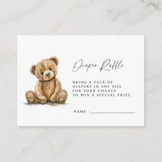 a brown teddy bear sitting on top of a white table card with the words diaper pull