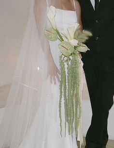 a bride and groom posing for a photo