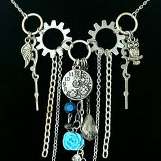 Lmg#483 Antique Silver Steam=Funk Fringe Statement Necklace Various Silver-Metal Finished Chains, Charms And Bead Components; Owl, Clocks, Clock-Hands, Feathers, Angel Wing And Other Delightful Charms, Various Crystal/Glass Beads, Blue Resin Rose Bead. Steam=Funk Fringe Statement Necklace... >>>Every Necklace Comes With Free Customized Earrings To Your Specifications<<< The "Steam=Funk" Collection: Funky And Complicated, Exaggerated Yet Reserved, Layered, The Mixing Of Many Trendy Styles; Bohemi Red Jewelry Necklace, Customized Earrings, Red Heart Necklace, Resin Rose, Native American Necklace, Amethyst Necklace Pendant, Wood Bead Necklace, Clock Hands, Red Jewelry