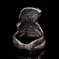 "Hand sculpted Barn Owl ring in sterling silver. This ring is very unique, the barn owl is an impressive and mysterious bird of prey. It suits men and women as well and even though this ring is wide on the front side, It is very comfortable on the finger. Carved by hand in the lost wax technique. Great gift for owl lovers. The barn owl, amazing and beautiful white owl as a totem animal associated with magic, clairvoyance and also called night eagle. It also symbolizes wisdom as it can see in the Unique Hand-cast Skull Ring, Collectible Hand Forged Sterling Silver Rings, Unique Hand-cast Silver Rings, Unique Hand Cast Silver Rings, Bronze Sterling Silver Rings, Mystical Hand Forged Silver Rings, Hand Forged Silver Skull Ring As Gift, Hand Forged Silver Skull Ring For Gift, Hand Cast Silver Skull Promise Ring