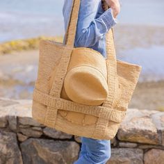 Our favorite Original Straw Traveler Bag now in a stripe colorway is sure to brighten up your spring and summer with a special built in spot for you favorite sunhat! Packable for easy travel and roomie for all of your sarongs, bathing suits and sunscreen. *Hat sold separately Product Overview: Material: 100% Raffia Straw, 100% Cotton Lining Measurements: 20" x 14", Handle Drop- 10" Spot Clean with Damp Cloth Easy Travel, Sun Hats, Travel Bags, Bathing Suits, Straw, Hats, The Originals, Travel, Clothes