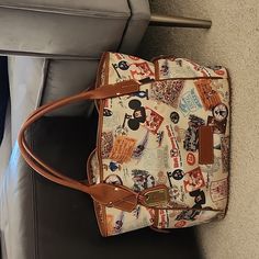 Disney Dooney & Bourke 40th Anniversary Kristen Handbag. Good/ Fair Condition Second Owner- I Have Never Used It- Making Room In My Closet! Disney Rectangular Shoulder Bag For Travel, Disney Style Rectangular Shoulder Bag For Travel, Brown Disney Bags For Everyday Use, Disney Style Brown Bag For Everyday Use, Disney Everyday Brown Bags, Disney Style Travel Shoulder Satchel Bag, Disney Rectangular Travel Bag, Disney Style Shoulder Bag For Travel, Disney Shoulder Bag With Removable Pouch For Travel