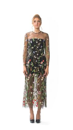 Sheer Embroidered Floral Long Column Dress with Long Sleeves and Attached Black Lining.  Dress has slightly flared hemline and Centre-back invisible zipper closure.  Dry Clean Only. All dresses are individually-made in Vancouver, Canada.  Dresses ship within 2 weeks of an order being placed. Fabric is 100% Polyester Embroidered Tulle.  Lining is 95% Polyester/5% Spandex. Dress is available in four sizes: XSMALL, SMALL, MEDIUM, and LARGE. Model is 5'10, 125lbs, and is wearing a size SMALL. X-SMAL Spring Evening Embroidered Dresses, Floral Print Maxi Embroidered Dress For Party, Floral Print Embroidered Maxi Dress For Party, Embroidered Floor-length Dress For Garden Party, Floor-length Embroidered Dress For Garden Party, Long Sleeve Dresses With Multicolor Embroidery For Party, Spring Party Dress With Intricate Embroidery, Spring Embroidered A-line Maxi Dress, Spring Garden Party Dress With Back Zipper