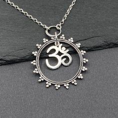 "Handmade Mandala Om Necklace is 925 solid sterling silver on an 925 solid sterling silver chain of your choice in style and length.  The Mandala pendant hold the Om charm that dangles freely.   Send a jewelry gift direct to your yoga bestie with a custom gift note! Om is a sacred sound that represents the union of the mind, body, and spirit that is at the heart of yoga. Ohm is a sacred syllable symbol of Hinduism and Buddhism and used in deep meditation. - Chain Styles:  Shiny Rolo or Oxidized Ohm Necklace, Ohm Pendant, Mandala Pendant, Om Necklace, Om Charm, Om Pendant, Yoga Necklace, Deep Meditation, Mind Body And Spirit