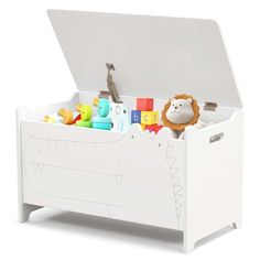 a white toy chest with toys in it