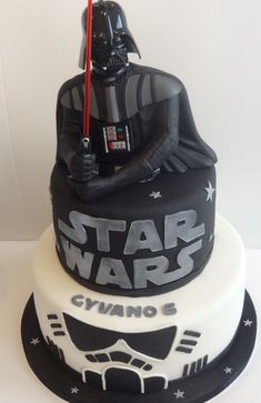 a star wars themed cake with a darth vader helmet on top