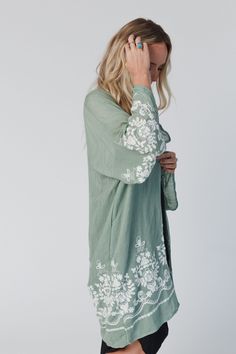 Crafted with floral embroidery, this soft cotton - blend kimono is a styling staple for effortlessly upgrading your everyday ensembles in a boho - chic fashion way. Oversized, relaxed fit. One size fits most. Model is 5'8" and wearing a size small. Approximate measurements: OS sizing fits most* sizes US 0 - 18 Bust: Open Fit 25" Length: 38.5" Sleeve length: 16.5" 65% Viscose 35% Polyester Hand wash cold, Lay flat to dry Import | Mazin Floral Kimono Top Bohemian Clothing, Womens Kimono, Floral Kimono, Bohemian Clothes, Chic Fashion, Perfect Woman, Boho Chic Fashion, Floral Embroidery, Lay Flat