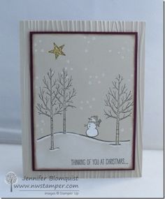 a christmas card with a snowman and trees