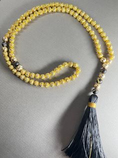 Gorgeous 8mm full tasbeeh- 99 beads with spacers between 33 beads.  This is a made out of high quality 18k gold plated beads and black agate accent stones Weight: 53 grams Length: 52 cm 30% of proceeds go to charity Shipping: Canada: Free Expedited shipping- 2-8 business days USA: Free Shipping- 6-12 business days Everywhere Else: 3 weeks Gold Spiritual Rosary For Meditation, Adjustable Gold Mala With 8mm Beads, Gold Mala With 8mm Beads For Meditation, Gold 108 Beads Mala For Meditation, Gold Mala With 108 Beads For Meditation, Gold Rosary With 8mm Beads For Meditation, Adjustable Gold Beaded Mala, Gold Mala With 108 Beads As Gift, Gold Rosary For Meditation