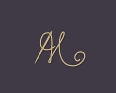 the letter al is written in cursive handwriting on a black background with gold lettering