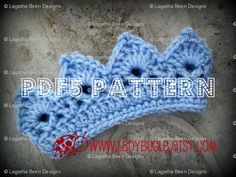 a crocheted blue crown with buttons on the side and text that reads pdd pattern