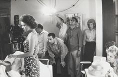 a black and white photo of people in a room