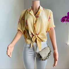 Item Details Description Collared Short Sleeve Floral Bow & Tie Boho Non Adjustable Waist Measurements Size M Sizing Chart 34.5" Chest, 21.5" Length Materials 55% Linen 45% Rayon Casual Yellow Blouse For Vacation, Trendy Yellow Short Sleeve Blouse, Mustard Spring Blouse For Vacation, Mustard Blouse For Spring Vacation, Trendy Yellow Beach Blouse, Chic Yellow Beach Blouse, Trendy Yellow Blouse With Floral Print, Yellow Short Sleeve Beach Blouse, Yellow Short Sleeve Blouse For Vacation