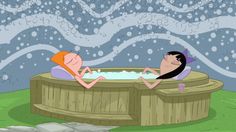 two people sitting in a wooden hot tub