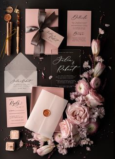 the wedding stationery is laid out and ready to be put into their guests'bags