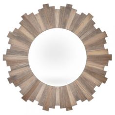 a circular mirror with wooden planks in the shape of sunbursts on it