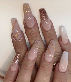 Trendy Long Nails 2023, Nude And Gold Nails Coffin, Nude And Glitter Acrylic Nails, Gold Nails Ballerina, Birthday Nails Design Ideas, Nude Gold Acrylic Nails, Acrylic Nails With Gold Accent, Gold Ombre Acrylic Nails, Nude Nail Ideas Acrylic