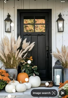 front porch decorated with pumpkins and flowers