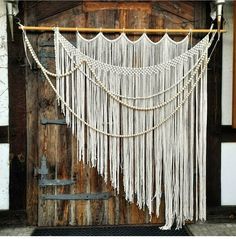 a wooden door with white string hanging from it