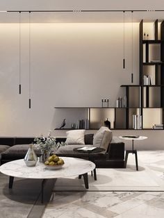 a living room filled with furniture and bookshelves next to a white table topped with fruit