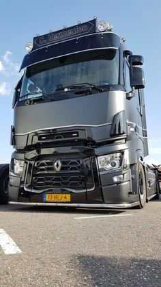 a large semi truck parked in a parking lot