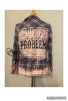 "We take preloved flannel shirts and create something new. Each one is bleached/distressed and has the design applied to the back in black. Each one is one of a kind so don't miss out.  Options we have in stock are shown in pictures. You will be receiving one of the shirts shown, so you know exactly what you are getting.  If you have any questions please feel free to message us. We are more than happy to help.  PLEASE PLEASE PLEASE look at the actual measurements when purchasing. Don't rely on the stated size every brand's and style's sizing is different  A- Faded Glory Size Large (12-14)      20\" across, 12.5\" underarm to hem      B- Comfort Outfitters 2x      21\" across, 16\" arm to hem C- Comfort Outfitters ladies' XL       18.5\" across, 13\" underarm to hem D- J. Crew Medium    18\ Bleached Flannels With Vinyl, Somebody’s Problem Jacket, Custom Flannel Shirts, Bleached Plaid Shirt, Recycled Flannel Shirts, Flannel Sublimation, Distressed Flannel Shirts, Bleached Flannel Shirts With Designs, Flannel Refashion