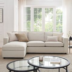 a living room scene with focus on the couch and coffee table in the foreground