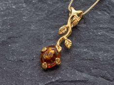 Leaf Amber Necklace set with a Natural Amber in a top grade & natural Amber color, at 10x8mm, 3 Carats, from Europe. Leaf Amber Pendant made of Gold Vermeil: 18k Gold over Solid 925 Sterling Silver ☞ made to last. Matching Ring: www.etsy.com/uk/listing/1003221278 Matching Earrings: www.etsy.com/uk/listing/1677535791 D E T A I L S ✓ Adina Stone GIFT BOX provided ♕ GUARANTEE on materials ♕ Hallmark on each piece ✓ Stone: Natural Amber, 10x8mm, 3 Carats (Europe) ✓ More Beautiful jewellery on www.et Luxury Amber Natural Stones, Luxury Amber Necklaces Fine Jewelry, Luxury Amber Necklaces With Large Pendant, Luxury Amber Necklaces With Stones, Luxury Amber Spiritual Necklace, Luxury Elegant Amber Crystal Necklaces, Brownish Yellow, Branch Necklace, Amber Pendant