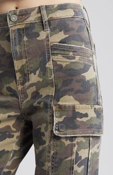 Cut from a camo-print cotton blend in a relaxed fit, these cargo pants exude laid-back, retro-cool style. 31" inseam; 11" front rise Zip fly with button closure Front slant pockets; back patch pockets; cargo flap-patch pockets 94% cotton, 5% polyester, 1% spandex Machine wash, tumble dry Imported Camouflage Cargo Jeans With Patch Pockets For Streetwear, Military Camouflage Jeans With Cargo Pockets, Military Cargo Style Camouflage Jeans, Military Camouflage Cargo Jeans, Camouflage Military Cargo Jeans, Camouflage Straight Leg Utility Cargo Pants, Camouflage Straight Leg Cargo Jeans With Multiple Pockets, Camouflage Straight Leg Cargo Pants, Camouflage Cotton Cargo Jeans