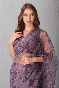 Mauve saree with floral printed motifs. Comes with blouse.
Component: 2
Pattern: Printed
Type Of Work: Floral Print
Neckline: V neck
Sleeve Type: Sleeveless
Fabric: Organza and Raw Silk
Color: Purple
Other Details: 
V neckline
Occasion: Wedding - Aza Fashions Mauve Saree, Purple Floral Print, Blouse For Women, Organza Saree, Saree With Blouse, Blouse Online, Printed Sarees, Raw Silk, Floral Printed