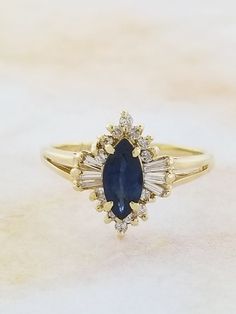 Sapphire and Diamond ring. Details: Size: US 5 1/2 ( Can be sized ) Weight: 2.8 grams Primary stone: Genuine Sapphire Shape: Marquise Secondary Stone: Diamond Shape: Round Metal: 14k Yellow Gold Condition: Previously worn/great condition Inside of band is stamped and tested for '14k' gold. All pieces are polished and refinished in our shop. SIZING: Currently this ring is a size 5 1/2 but could be sized up or down for an additional small fee if desired by adding custom ring sizing to your cart up Sapphire Accent Engagement Ring, Future Engagement Rings, Amethyst Studs, Knot Stud Earrings, Knot Studs, Sapphire And Diamond Ring, Custom Ring, Initial Ring, Multi Stone Ring