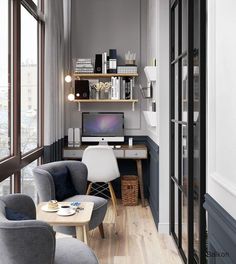 a living room filled with furniture and a computer desk on top of a hard wood floor