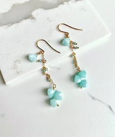 Pretty seafoam amazonite gemstones dangle in these earrings. Paired with petite faceted zircon for added sparkles. They make a great earring for parties. Triangle Earrings, Sea Foam, Sparkle, Gemstones, Blue