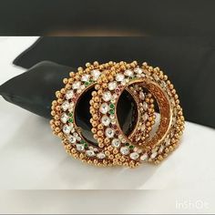 *This is Gold Finish Kundan Bangles Pair.Its Perfect for Wedding Occasion as well as Unique and Ethnic Traditional Bangle to gift and Also Bridal wear to match with Wedding Outfits. *Its made from Silver n Copper mix material and 100% Handmade. *Its available in Various Sizes like 2,2.2,2.4,2.6 Etc Its Pink, Green and white kundan combination like shown in picture. *Its open able Screwed Bangles Pair. *All Kundan stones set with silver foils handsetting method and long last guarantee of its work Temple Jewelry Style Jeweled Bangle For Wedding, Temple Style Jeweled Bangle For Weddings, White Bollywood Bangle For Wedding, Wedding Meenakari Toe Ring Jewelry, Jeweled Bracelets For Wedding And Diwali, Bollywood Style White Wedding Bangle, Jeweled Toe Ring For Wedding, White Bollywood Style Wedding Bangle, White Wedding Bangle For Festive Occasions